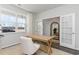 Bright home office with a large window, a wooden desk, and a comfortable chair on a jute rug at 348 Rookroost Circle, Conway, SC 29526