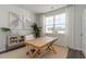 Bright home office with a large window, a wooden desk, and a comfortable chair on a jute rug at 348 Rookroost Circle, Conway, SC 29526