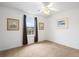 Bedroom features a ceiling fan, neutral carpet, and a window with brown curtains at 3567 Chestnut Dr. # 3567, Myrtle Beach, SC 29577