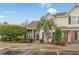 Charming townhouse featuring brick and siding, a manicured lawn, and mature landscaping at 3567 Chestnut Dr. # 3567, Myrtle Beach, SC 29577