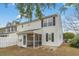 Exterior view of the house from the backyard, featuring an enclosed porch and a privacy fence at 3567 Chestnut Dr. # 3567, Myrtle Beach, SC 29577