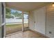 Enclosed porch with tile floors, a white privacy fence, and easy access to the backyard at 3567 Chestnut Dr. # 3567, Myrtle Beach, SC 29577