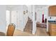 Bright foyer and staircase with neutral carpet and access to other living areas at 3567 Chestnut Dr. # 3567, Myrtle Beach, SC 29577