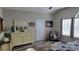 Relaxing bedroom with light filled window, stylish dresser and mirror, and comfortable seating area at 372 Leste Rd., Myrtle Beach, SC 29588