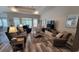 Spacious living room featuring neutral tones, plenty of seating, tray ceiling, and natural light at 372 Leste Rd., Myrtle Beach, SC 29588