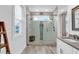 Bright bathroom featuring a window and a large glass shower with dual shower heads at 39 Lazy Hammock Trail, Pawleys Island, SC 29585