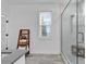 Bright bathroom with a glass shower and a wooden rack for storage at 39 Lazy Hammock Trail, Pawleys Island, SC 29585