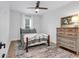 Bedroom with wooden floors, ceiling fan, and decorated with a painting at 39 Lazy Hammock Trail, Pawleys Island, SC 29585