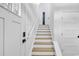 Staircase with white risers and wood treads at 39 Lazy Hammock Trail, Pawleys Island, SC 29585