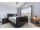 Bedroom with a black bed frame, bright window, ceiling fan, and neutral paint at 401 Barton Loop, Myrtle Beach, SC 29579