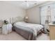 Bedroom features a queen bed with a white metal frame, ceiling fan, and bright window at 401 Barton Loop, Myrtle Beach, SC 29579