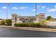 Highland Woods community entrance sign with manicured landscaping and brick pillars at 401 Barton Loop, Myrtle Beach, SC 29579