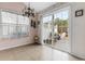 Cozy dining area with stylish chandelier and large windows overlooking backyard at 401 Barton Loop, Myrtle Beach, SC 29579