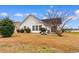 Back of the home with patio area and well-kept lawn, perfect for outdoor living at 401 Barton Loop, Myrtle Beach, SC 29579