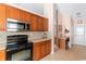 Traditional kitchen featuring wooden cabinets, modern appliances, and plenty of counter space at 401 Barton Loop, Myrtle Beach, SC 29579