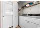 Bright laundry room with white washer and dryer, and a door to the exterior at 401 Barton Loop, Myrtle Beach, SC 29579