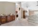 A living room showing an antique hutch and connecting to the kitchen with a built-in breakfast nook at 401 Barton Loop, Myrtle Beach, SC 29579