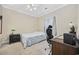 Bedroom with a neutral color scheme, cozy bed, desk area, and natural light from the window at 4142 Hibiscus Dr. # 103, Little River, SC 29566