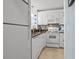 Well-equipped kitchen with white cabinetry, tiled backsplash, and modern appliances at 415 Ocean Creek Dr. # 2159, Myrtle Beach, SC 29572