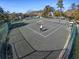 Overhead view of community tennis courts surrounded by trees; a perfect spot for recreational play at 415 Ocean Creek Dr. # 2159, Myrtle Beach, SC 29572