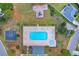 Aerial view of community pool featuring a playground and a basketball court, set on a clear day at 4387 Heartwood Ln., Myrtle Beach, SC 29579