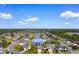 Aerial view of the 4387 Heartwood Ln neighborhood with multiple ponds, green trees, and blue skies at 4387 Heartwood Ln., Myrtle Beach, SC 29579