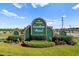 Carolina Forest community sign with brick accents, green facade, and well-manicured landscaping at 4387 Heartwood Ln., Myrtle Beach, SC 29579