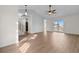 Bright living room features wood floors, vaulted ceiling, and sliding glass doors to the patio at 4387 Heartwood Ln., Myrtle Beach, SC 29579