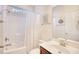 Bright bathroom featuring shower-tub combo, single sink vanity, and decorative fish accents at 440 Woodpecker Ln. # A, Murrells Inlet, SC 29576