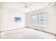 Bright bedroom with neutral carpet, double windows with natural light, and beach-themed decor at 440 Woodpecker Ln. # A, Murrells Inlet, SC 29576