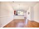 Open dining room featuring hardwood floors and view of the kitchen at 440 Woodpecker Ln. # A, Murrells Inlet, SC 29576