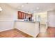 Kitchen featuring dark wood cabinets, stainless steel appliances, and an open layout, perfect for modern living at 440 Woodpecker Ln. # A, Murrells Inlet, SC 29576