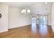 Bright living room with wood floors and access to the patio at 440 Woodpecker Ln. # A, Murrells Inlet, SC 29576