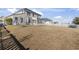 Expansive backyard with a privacy fence and a view of the home's back exterior at 445 Mooreland Dr., Myrtle Beach, SC 29588