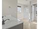 Well-lit bathroom featuring a double sink vanity, glass enclosed shower and tile flooring at 445 Mooreland Dr., Myrtle Beach, SC 29588