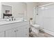 Bathroom featuring white cabinets, a walk-in shower, and a large mirror at 445 Mooreland Dr., Myrtle Beach, SC 29588