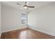 Bright bedroom featuring gleaming hardwood floors, a ceiling fan, and large windows for ample natural light at 445 Mooreland Dr., Myrtle Beach, SC 29588