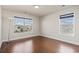 This spacious bedroom features hardwood floors and plenty of natural light from two windows at 445 Mooreland Dr., Myrtle Beach, SC 29588