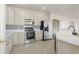 Well-lit kitchen featuring stainless steel appliances, neutral cabinets, and a mosaic tile backsplash at 445 Mooreland Dr., Myrtle Beach, SC 29588