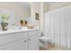 Bathroom featuring a single vanity with a white cabinet, tiled flooring, and a shower with a white curtain at 446 Deerfield Links Dr., Surfside Beach, SC 29575