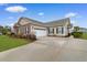 Charming single-story home with manicured lawn, long driveway and an attached two-car garage at 446 Deerfield Links Dr., Surfside Beach, SC 29575