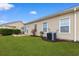 Exterior view of a home with a well-maintained lawn and a neutral color scheme at 446 Deerfield Links Dr., Surfside Beach, SC 29575