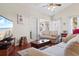 Comfortable living room featuring hardwood floors, a neutral color palette, and lots of natural light at 446 Deerfield Links Dr., Surfside Beach, SC 29575