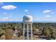 Aerial shot of the Surfside Beach water tower overlooking lush tree canopy and ocean at 446 Deerfield Links Dr., Surfside Beach, SC 29575