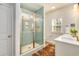 Modern bathroom with a glass-enclosed shower and a stylish white vanity with quartz countertop at 474 Wraggs Ferry Rd., Georgetown, SC 29440