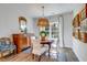 Charming dining area featuring hardwood floors, a round table, and a stylish chandelier at 474 Wraggs Ferry Rd., Georgetown, SC 29440