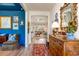 Hallway with decorative rug and traditional furnishings leads to a bright living area at 474 Wraggs Ferry Rd., Georgetown, SC 29440