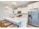 Well-equipped kitchen featuring white cabinetry, quartz countertops, and stainless steel appliances at 474 Wraggs Ferry Rd., Georgetown, SC 29440