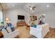 Spacious living room with vaulted ceiling, fireplace, and casual seating arrangement at 474 Wraggs Ferry Rd., Georgetown, SC 29440