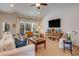 Open living room with vaulted ceiling, casual seating, and a view of the dining area at 474 Wraggs Ferry Rd., Georgetown, SC 29440